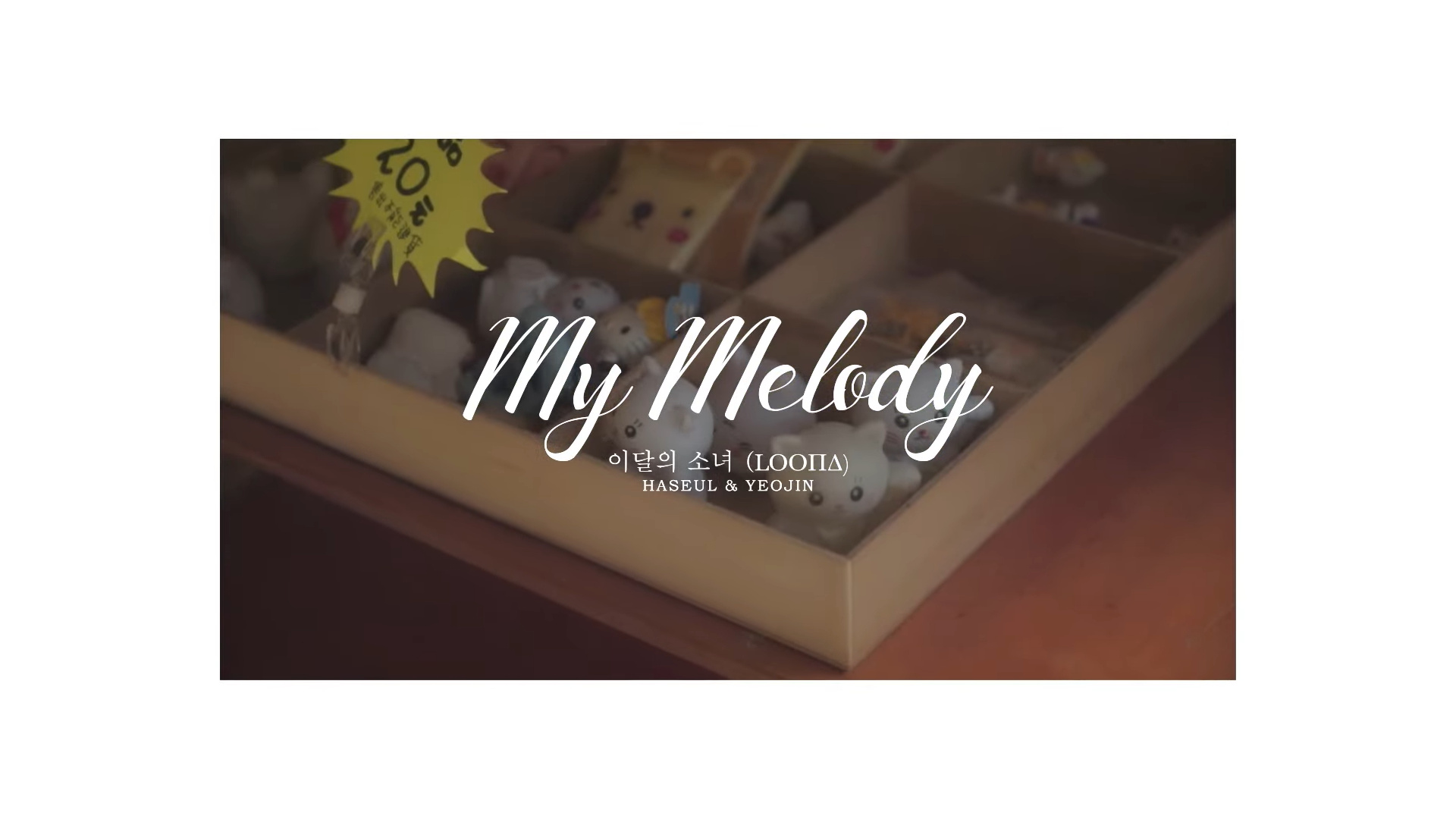 A container of cat figurines. There is white text over it reading 'My Melody, Loona, Haseul and Yeojin.'